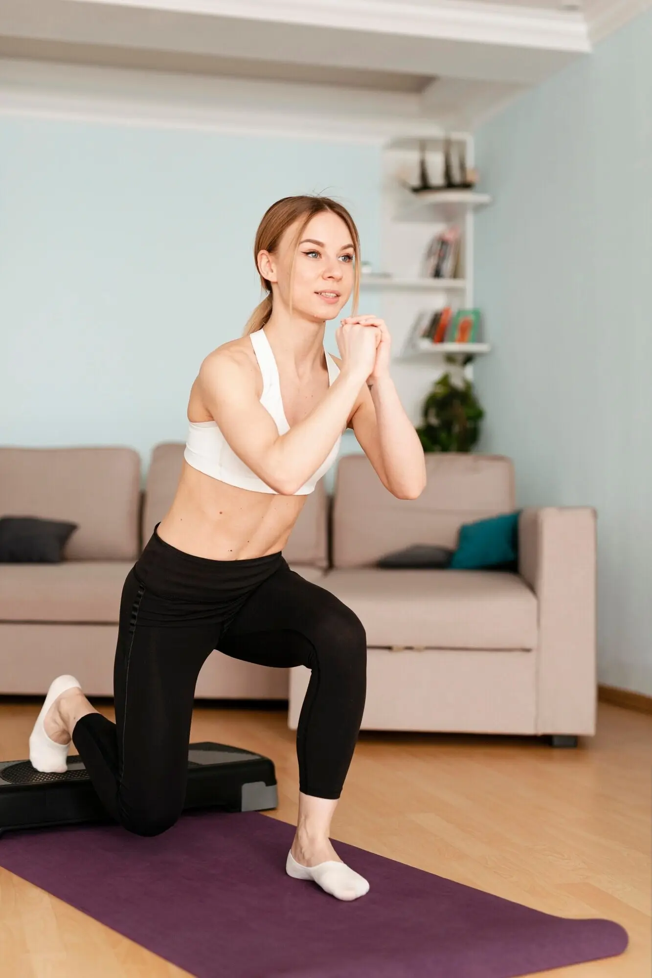 A woman exercising at home.