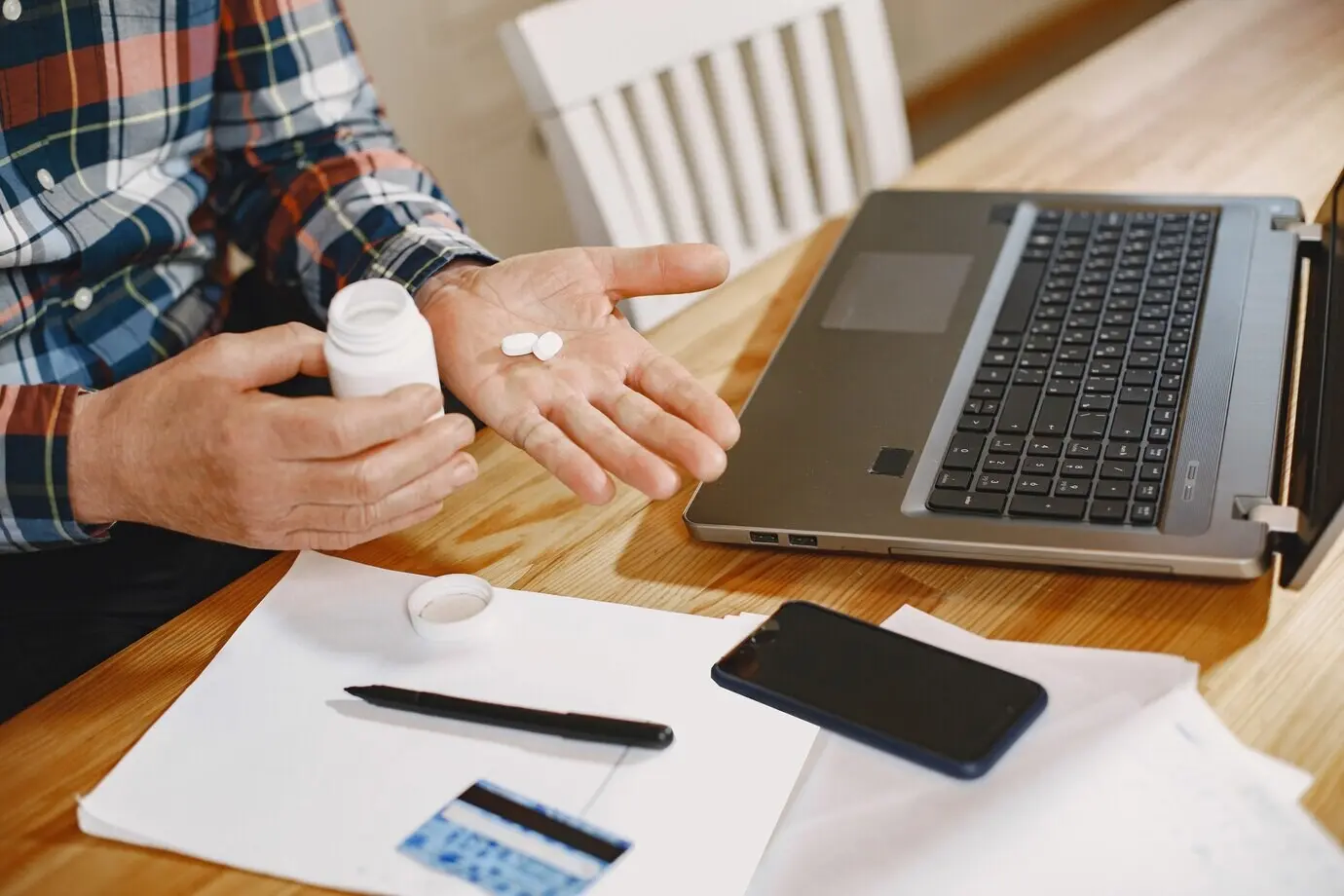 Elderly man with a laptop.